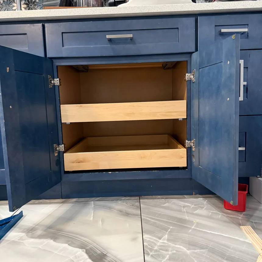 The same navy blue cabinet fitted with two full-extension wooden drawers